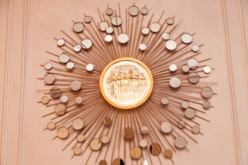 Modern Decorative Wall Art with Evening Lighting. A modern decorative wall art piece illuminated by warm evening light, showcasing a stunning circular design.