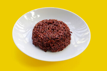 Cooked black berry rice in white plate