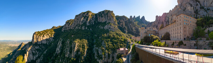 Panoramic view of Montserrat mountain in Catalonia with its monastery located on the heights during a sunny spring afternoon