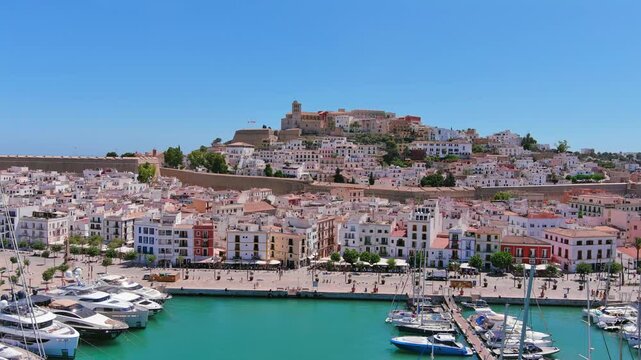 Ibiza Town, Spain: Aerial view of capital city of Ibiza island, Castle of Ibiza (Castell d'Eivissa or Almudaina) towering over Eivissa Harbour, summer day - landscape panorama of Europe from above
