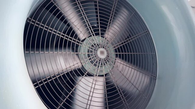 Close-up of a large, gray, industrial fan