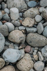 Abstract smooth round pebbles sea texture background. Stones in Faroe island