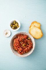 Traditional steak tartare with capers