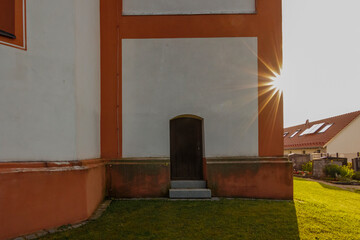 Back door of the church of St Sebastian in the Bavarian town of Puch near Munich in Germany © were