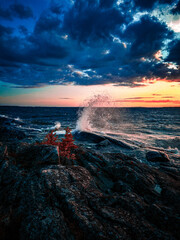 Naklejka premium Splashing wave on the lake Melaren in the night.