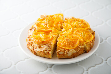 Homemade vanilla cake with candied orange