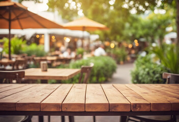 Fototapeta premium An inviting outdoor cafe setting with a warm wooden table in the foreground and blurred patrons enjoying their time in the background. Perfect for food blogs, restaurant websites, travel articles, or 