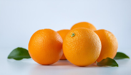 Vibrant fresh oranges on white table. Tasty and sweet fruit. Juicy citrus. Natural and healthy.