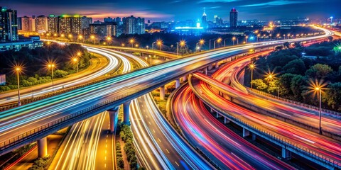 Fototapeta premium Aerial View of City Highway with Light Trails at Night
