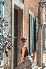 Travel. Woman walking through old town and sightseeing, eco travel, solo female travel, digital nomad, vacation, business travel, nomad aesthetic,travel old town