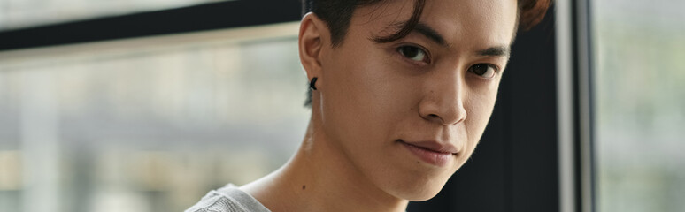 A young man gazes intently, radiating focus and purpose.