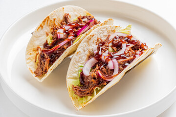 Mexican tacos with pulled pork, avocado, chili peppers