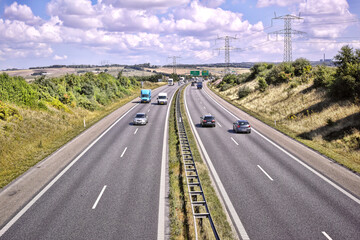 Naklejka premium Cars, highway and transportation with driving for journey, movement and travel on freeway for road trip. Outdoor, vehicle and moving fast on motorway, urban commute and expressway or direction.