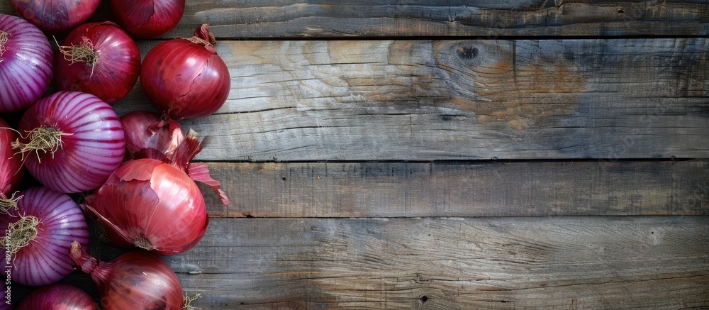 Poster red onions arranged beautifully on a wooden surface providing ample copy space image for your conten