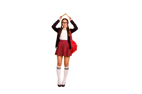 Full length body size view of her she nice attractive bored girl holding in hands book over head like roof boring classes courses pass exam test isolated over bright vivid shine yellow background