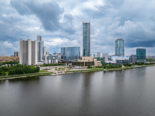 Fototapeta premium Yekaterinburg city with Buildings of Regional Government and Parliament, Dramatic Theatre, Iset Tower, Yeltsin Center, panoramic view at summer sunset.