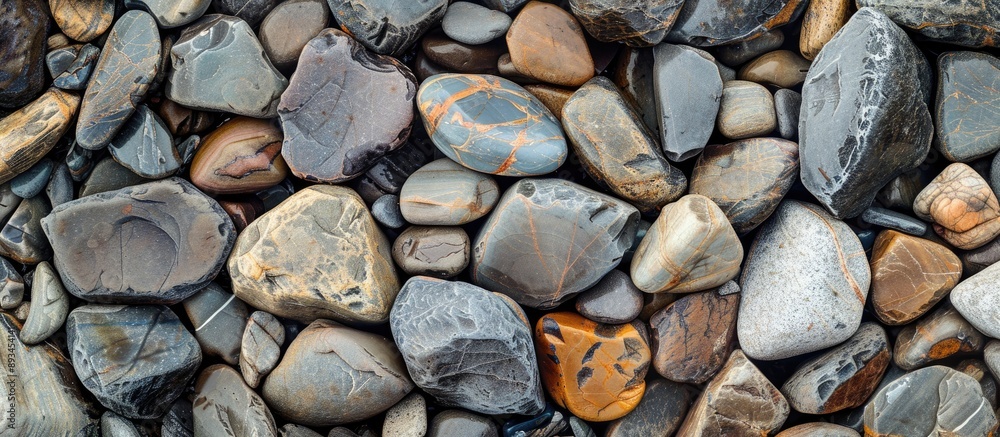 Aufkleber background of rippled rocks showing a close up view of natural rough stones includes copy space imag