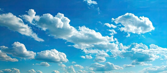 A serene blue sky with various cloud formations ideal as a backdrop or for text overlays in designs enhanced for copy space image