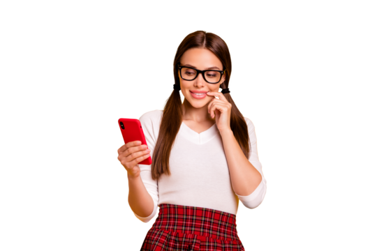 Portrait of her she nice-looking attractive lovely sweet winsome pensive cheerful foxy girl wearing uniform holding in hand cell reading blog post isolated on bright vivid shine yellow background