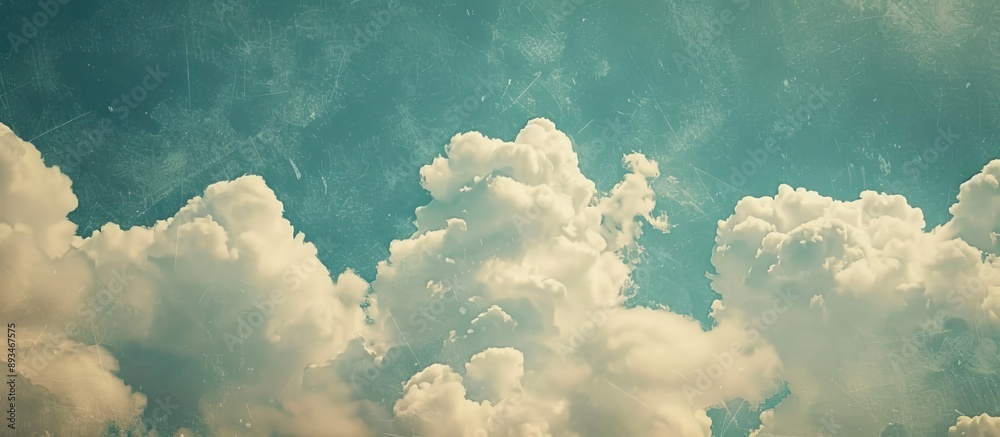 Poster blue sky featuring clouds with a textured backdrop, providing copy space image.