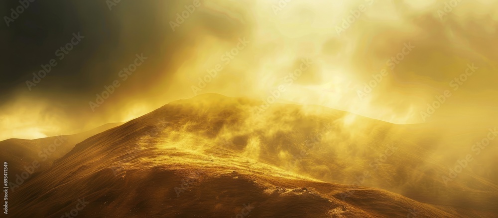 Poster Mountain bathed in sunlight showcases yellow and brown hues with dark clouds drifting in the background, featuring noise and grain in the copy space image.