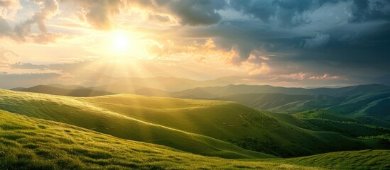 Scenic outdoor landscape with lush green hills cloudy sky sun rays at sunset creating a picturesque nature background with copy space image