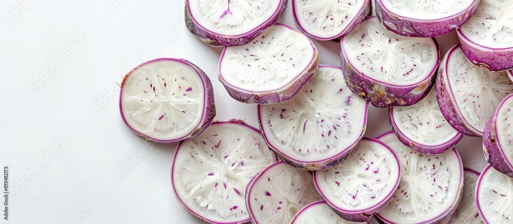 Poster Taro slices displayed on a clear white background with copy space image
