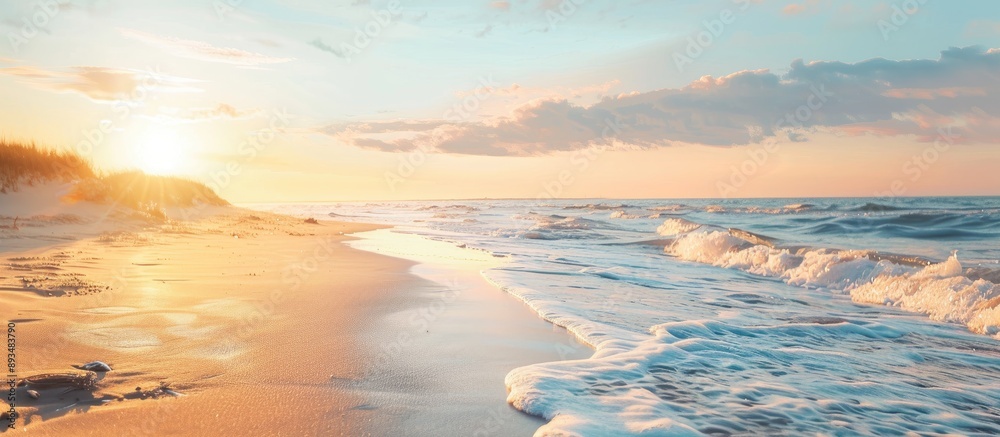 Poster coastline at sunset with a view of the ocean and a sandy beach with a copy space image