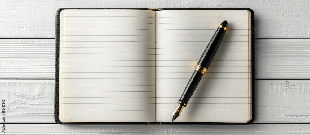 Leinwandbilder fountain pen positioned on an open blank notebook against a white backdrop in a copy space image