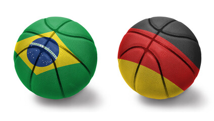 basketball balls with the national flags of germany and brazil on the white background.