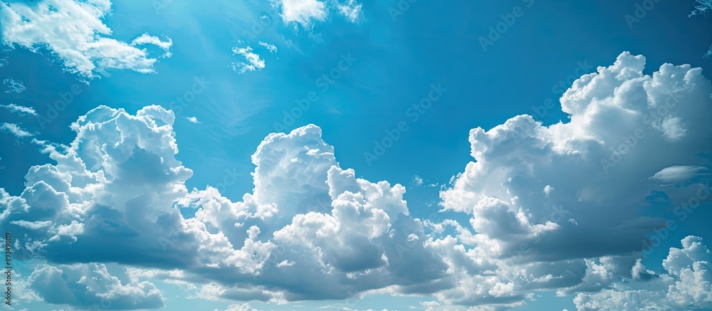 Aufkleber Scenic view of a blue sky with fluffy white clouds ideal for adding text or graphics with copy space image