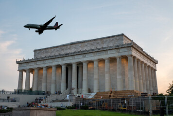 Abraham Lincoln Memorial evening view with plane landing in background