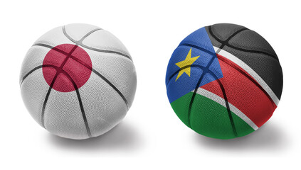 basketball balls with the national flags of south sudan and japan on the white background.