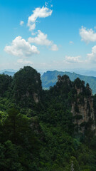 Zhangjiajie national forest park, China, Glass bridge of Zhangjiajie China Tianzishan with blue sky, concept of world heritage, avatar, heritage peak or cliff mountain, tourist attraction famous place