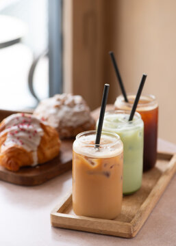 selection of iced coffee and matcha drink on a coffee shop table. Minimalist concept.