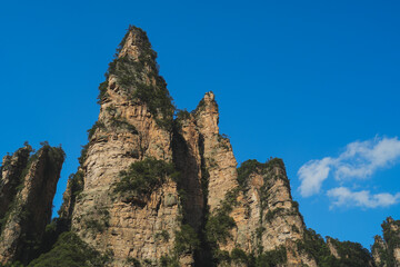 Zhangjiajie national forest park, China, Glass bridge of Zhangjiajie China Tianzishan with blue sky, concept of world heritage, avatar, heritage peak or cliff mountain, tourist attraction famous place