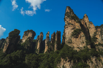 Zhangjiajie national forest park, China, Glass bridge of Zhangjiajie China Tianzishan with blue sky, concept of world heritage, avatar, heritage peak or cliff mountain, tourist attraction famous place