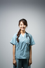 An Asian surgeon in a surgical mask and scrubs