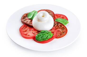 Burrata cheese with tomatoes and basil, on a plate on a white background.