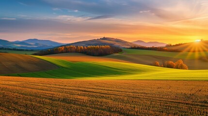 Autumn sunset over a rolling field, picturesque, fall