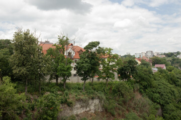 A view from the Smotrytsky Canyon in Kamianets-Podilskyi city. There are poor trees by the cliff