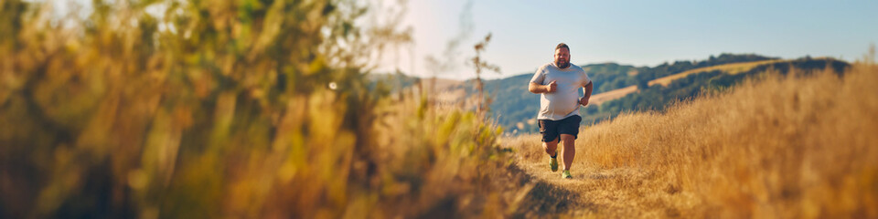 Fototapeta premium Overweight man going for a run