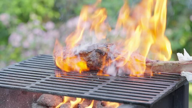 A product of animal origin, most likely beef , sizzles on the grill, emitting enticing flavors. Animal fat is used in the cooking process, and it is soon served as a delicious dish in this kitchen
