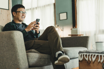 man using cell phone holding mobile texting message contact us.chatting,search internet shopping online.technology device communication connecting