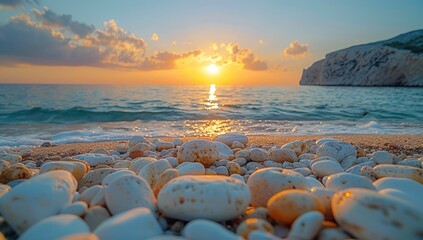 Sun Setting Over a Pebble Beach