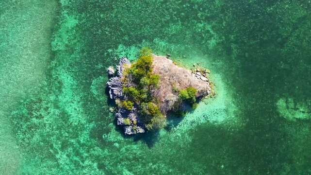 Aerial view of a tiny island outside Rangko Cave in Tanjung Boleng, Boleng, West Manggarai Regency, Flores, East Nusa Tenggara, Indonesia