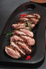 Fried duck breast with fresh orange and ginger, ready to eat food. Domestic cuisine, poultry meat