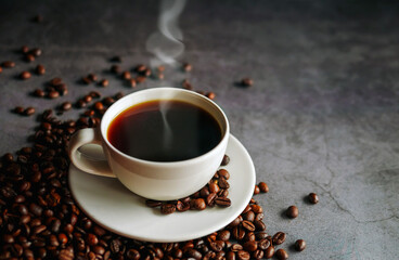 Coffee cup and coffee beans on  gray background, Black coffee cup aromatic