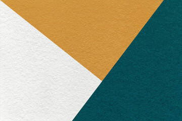 Fototapeta premium Texture craft white, yellow and teal color paper background, macro. Vintage abstract ocher cardboard