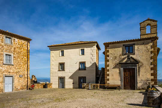 A glimpse of the ancient medieval village of Celleno, Viterbo, Italy. Ghost town, with houses in ruins, abandoned and uninhabited. Some of the buildings left standing in the center of the town.